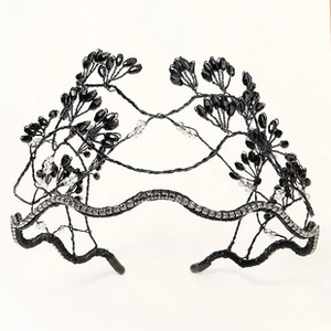 Detailed close-up of handmade beaded crown headband with black crystals and diamonds