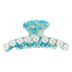 Detail of blue marble acetate hair claw with shell pleats and faux pearl inlay