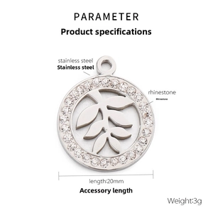 Macro detail of a 20mm stainless steel leaf pendant with sparkling rhinestone inlay decor