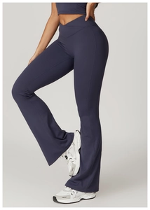 Detail view of high waist crossover V-shape yoga flare pants in dark grey blue finish