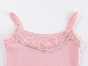 Detailed close-up of pink modal camisole featuring delicate lace trim and ribbed texture
