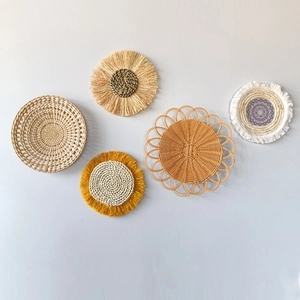 Set of 5 bohemian woven wall baskets with natural grass patterns and yellow tassel