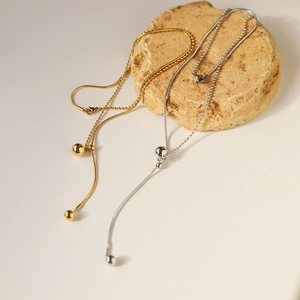 Minimalist adjustable Y-shaped sweater necklace in gold and silver stainless steel