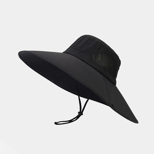 Detail of black wide brim sun hat featuring breathable side mesh and adjustable chin cord