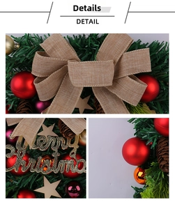 Detail of Christmas wreath with red balls, pine cones, and Merry Christmas sign