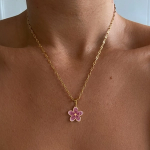 Detail of pink enamel flower pendant on 18k gold-plated paperclip chain necklace