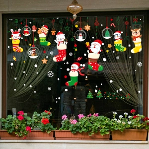 Christmas window static stickers featuring Santa and reindeer in colorful stockings