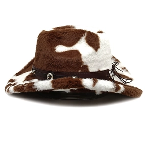 Detail of western cow print hat featuring star badge and leather band with metal studs
