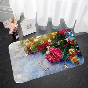 Detailed view of festive flannel Christmas mat with red ornaments on dark wood floor