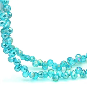 Macro view of 6-8mm sky blue faceted teardrop glass beads with iridescent coating
