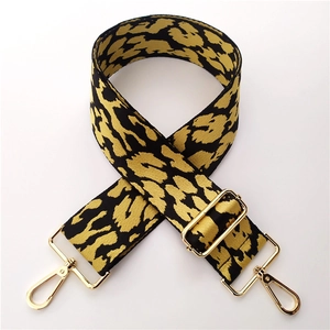 Detail of high-density 5cm leopard print jacquard strap with gold metal buckles