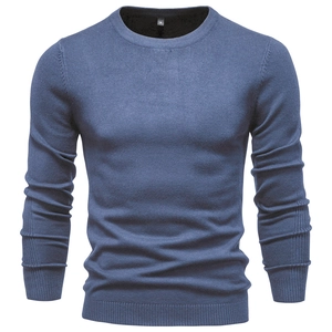 Detailed close-up of blue slim fit crewneck sweater showing fine knit texture and size S label