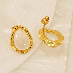 Irregular water-drop resin earrings with gold hammered metal frames in 45-degree angle view