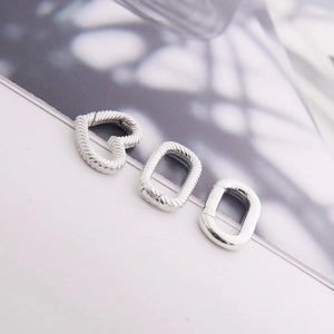 Detail of silver S925 heart and oval spring clasps with woven rope texture for jewelry DIY