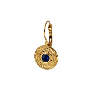 Detail of a vintage gold earring with a deep blue gemstone and intricate woven texture