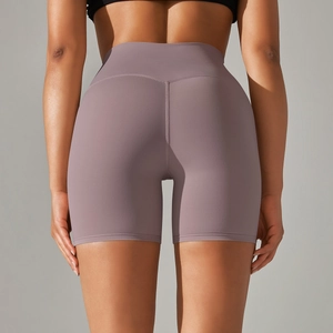 Detail view of high waisted yoga shorts featuring V-shaped back seams for body shaping