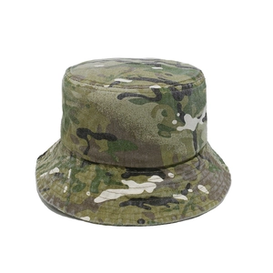 Detailed close-up of multi-color jungle camo pattern and stitching on a cotton sun hat