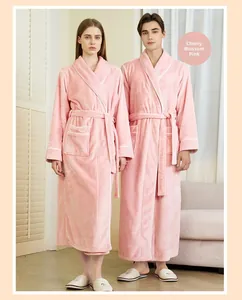 Detail of cherry blossom pink flannel bathrobe with contrast white piping and waist tie