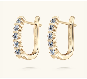Detail view of gold-plated S925 silver U-shaped earrings with 0.30CT stones and engravings