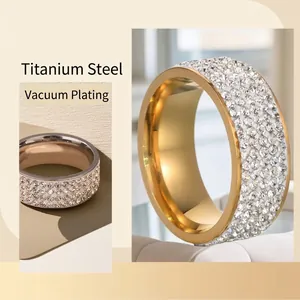 Luxe gold titanium steel wide ring featuring four rows of shimmering pavé zircons