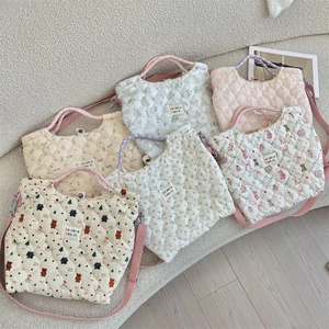Detailed display of six quilted cotton crossbody bags with various cute animal prints