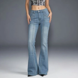 Detail showing the light blue denim fabric with front seam stitching on flare jeans