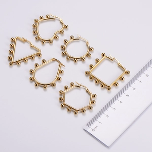 Gold stainless steel geometric earrings set featuring heart and circle shapes with bead edges