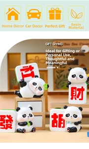 Detail of creative panda figurines holding mahjong tiles made of resin for desk decor