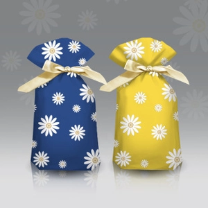Navy blue and yellow drawstring gift bags with white daisy patterns and gold ribbons