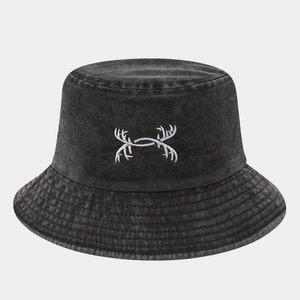 Close-up of black washed denim bucket hat with detailed white symmetrical embroidery
