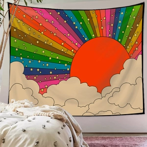 Detail of bohemian rainbow tapestry with sun and stars hanging over a bedroom bed