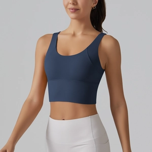 Detail of navy blue V-back sports bra with wide straps and seamless high-elastic fabric