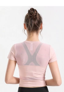 Detail of pink sports top featuring breathable back mesh panel and sleek slim fit cut