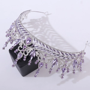 Detailed view of luxury silver bridal crown with purple crystal water drop rhinestones