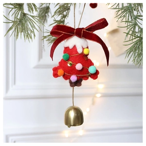 Detail of red wool felt Christmas tree ornament with velvet bow and golden bell