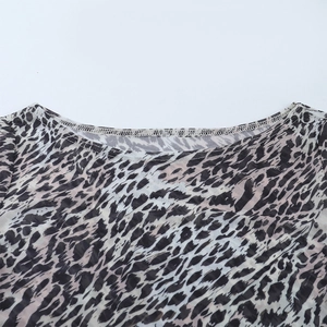 Detail of boat neck collar and stitching on sexy leopard print mesh long sleeve top
