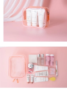 Flat lay of pink transparent PVC makeup bag with high capacity storage and waterproof material