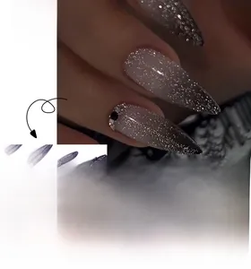 Detail of purple to black gradient press-on nails with glitter finish and rhinestones