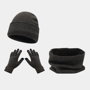 Close-up of dark grey knitted winter set showing thick scarf texture and touchscreen gloves