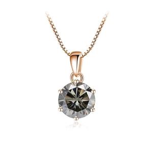 Macro detail of 1 carat moissanite pendant with 6-prong rose gold setting on chain