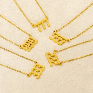 Golden matte stainless steel angel number necklace set featuring 111-999 pendant designs