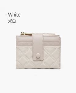 Detail view of cream quilted PU leather short wallet with card slots and zipper pocket