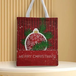 Close-up of a red Christmas canvas bag with festive ornament and pine branch prints