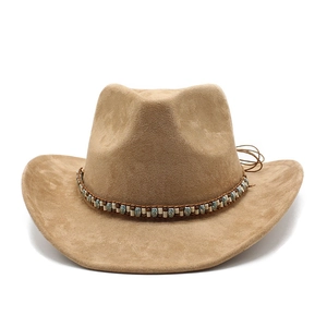 Close-up of camel suede cowboy hat featuring ethnic beaded band and leather cord detail
