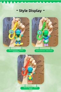 Detailed close-up of three colorful cartoon dinosaur keychains with braided wrist straps