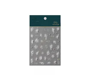 Macro detail of TL-102 3D nail stickers featuring white floral relief and pearl accents