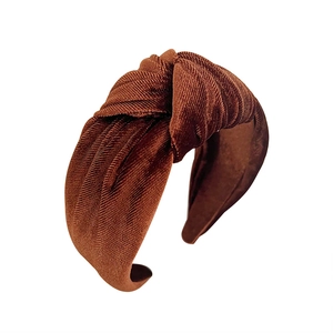 Caramel velvet wide knot headband with a vintage minimalist style on a white background