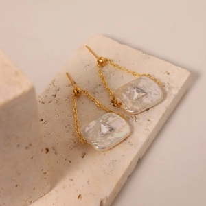 Baroque freshwater pearl drop earrings with gold chains and geometric zircon accents