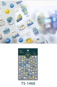 Macro view of 3D embossed blueberry cake nail stickers with glossy cartoon dessert patterns