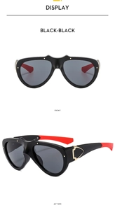 Front and side view of sporty oversized black sunglasses with red temples and grey lenses
